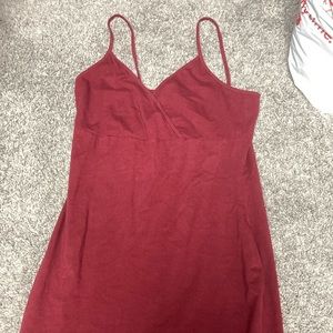 a mid length maroon v cut with spaghetti straps